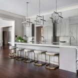 dark stained white oak live sawn hardwood floor in a white and gray kitchen